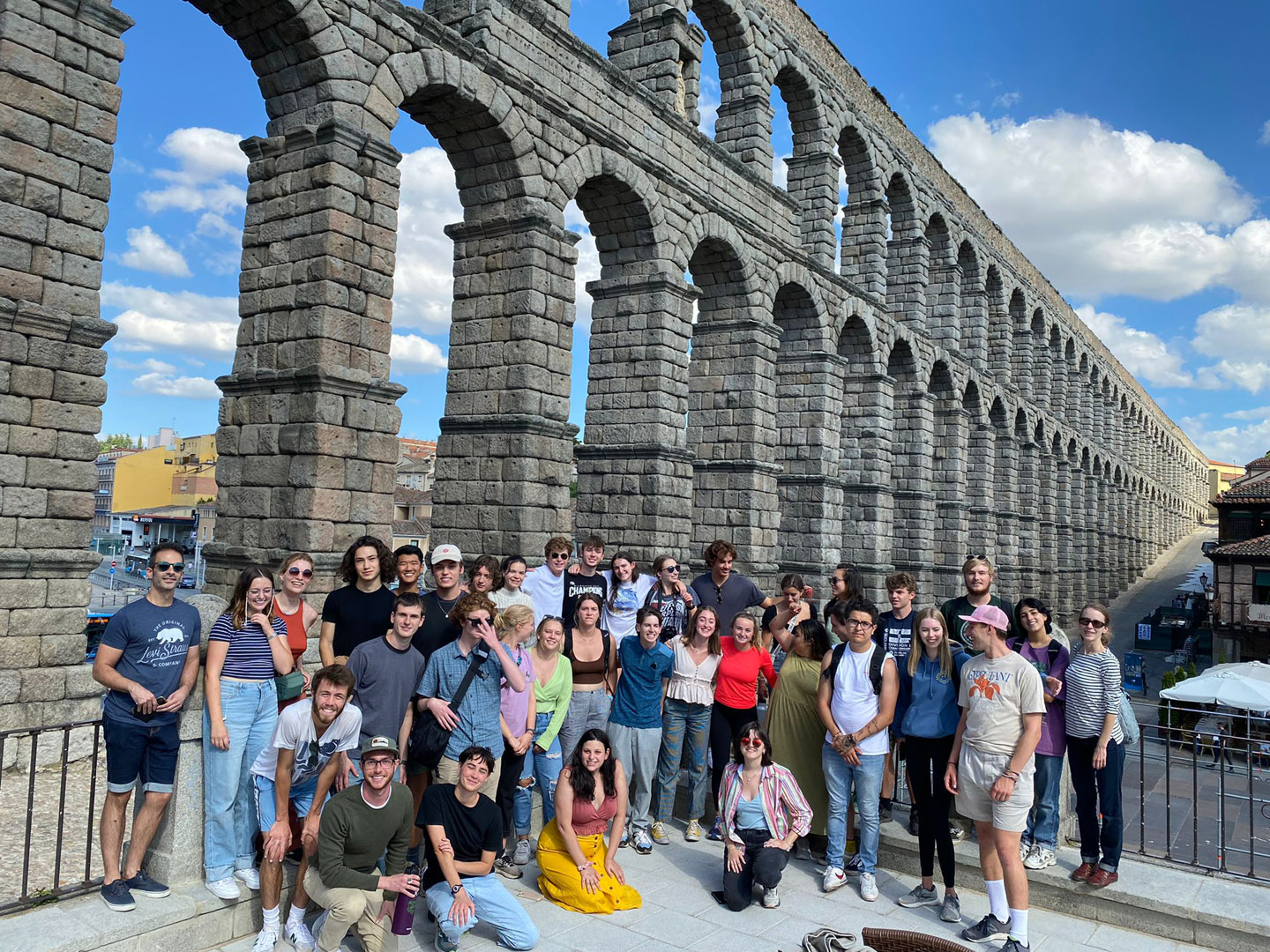 Colorado College students studying in Spain are pictured in front of an ancient Roman aqueduct, which was likely built near the end of the 1st century. Photo by Carrie Ruiz